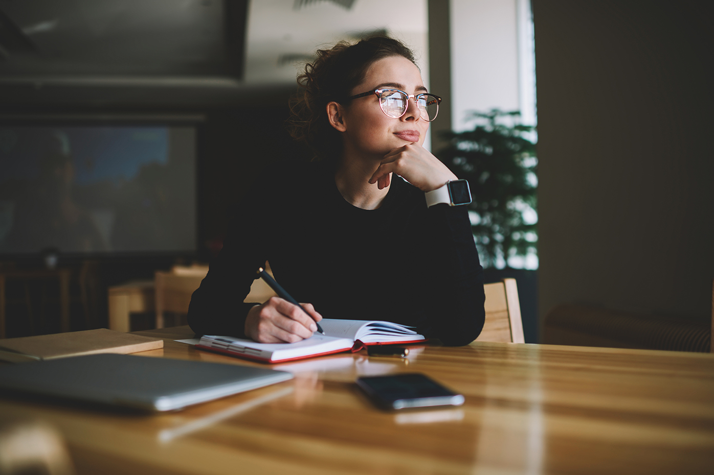 Woman at table making a decision