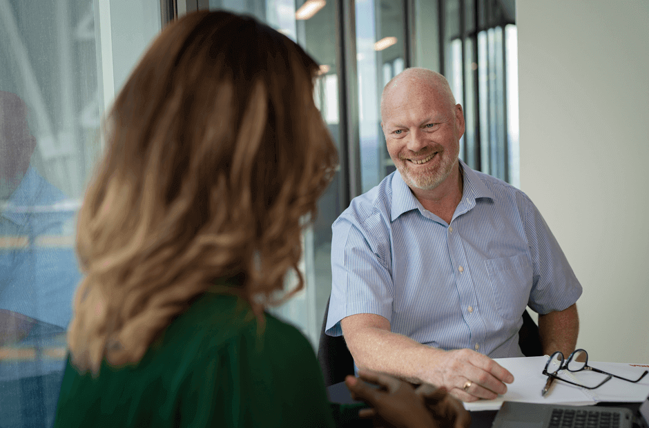 A senior leader in RGA's Global Health team meets with a colleague