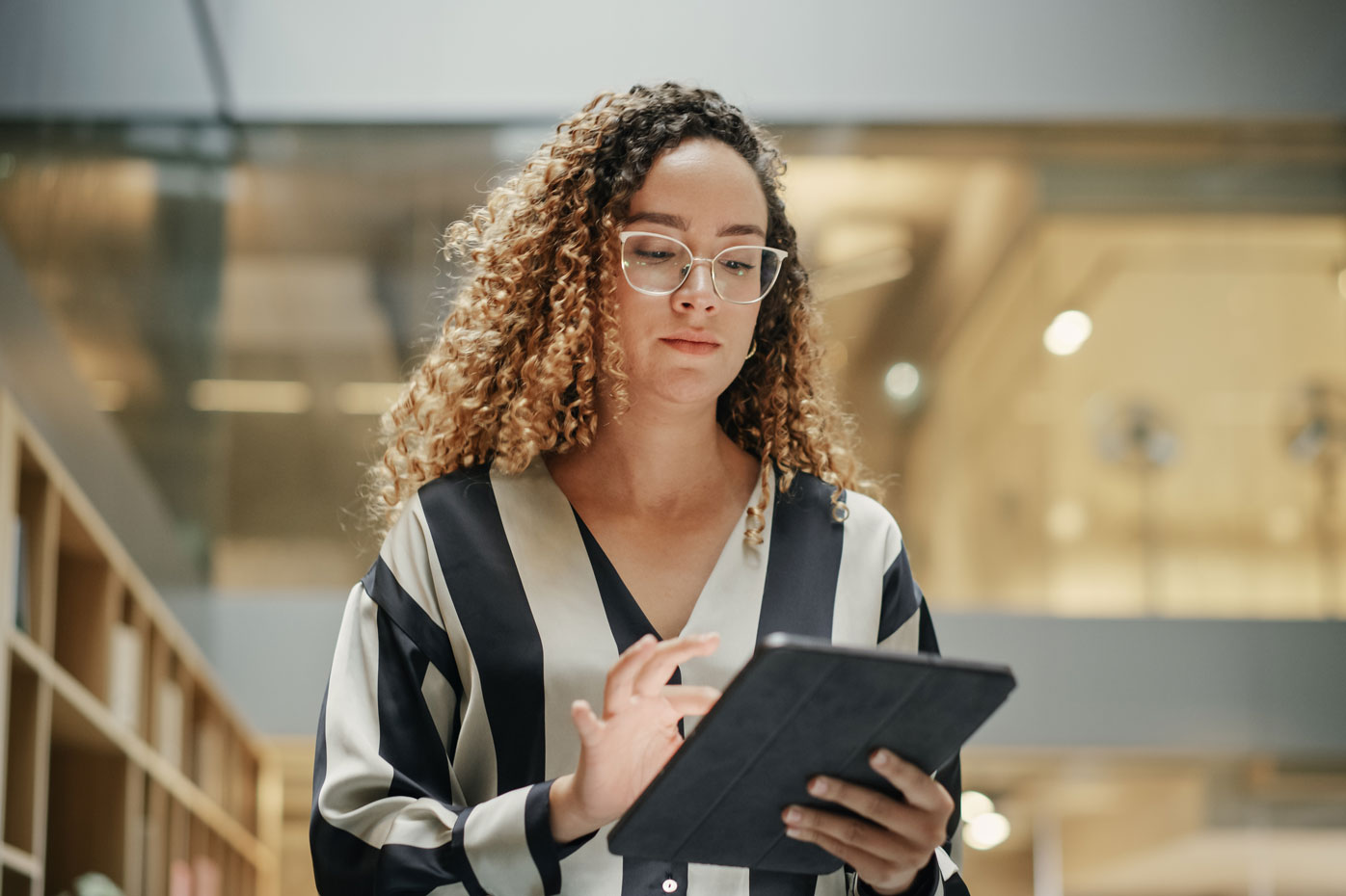 A woman using an ipad to assess comorbidities