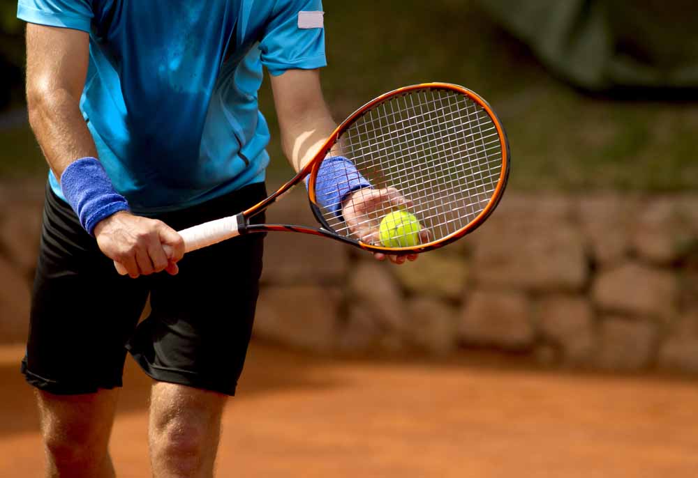 Tennis player with racket