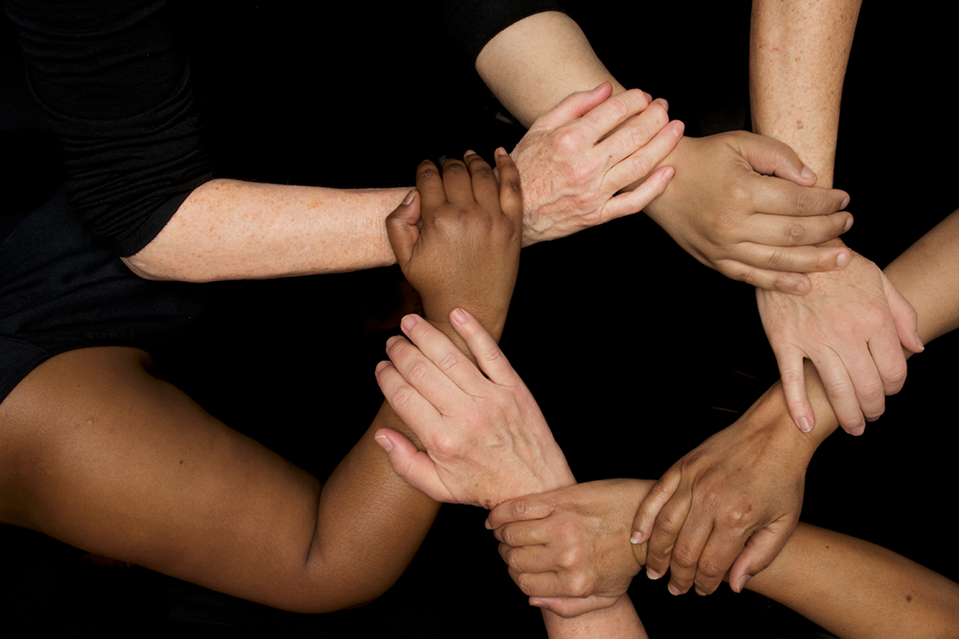 International Women's Day: Groups of hands around the world