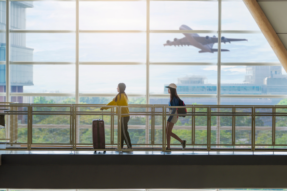 Image of family walking through airport