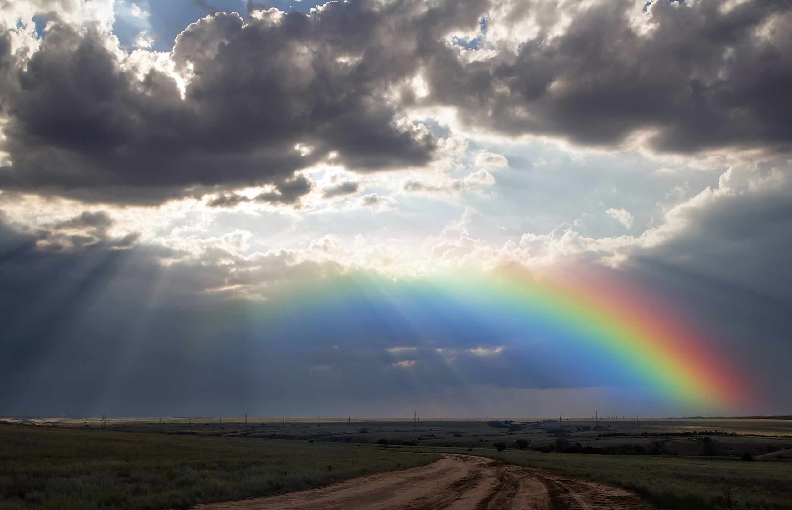 Rainbow breaks through clouds