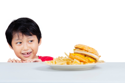 Hungry child eying fast food