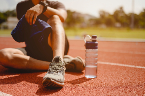 Wellness research: Image of male exerciser on a track