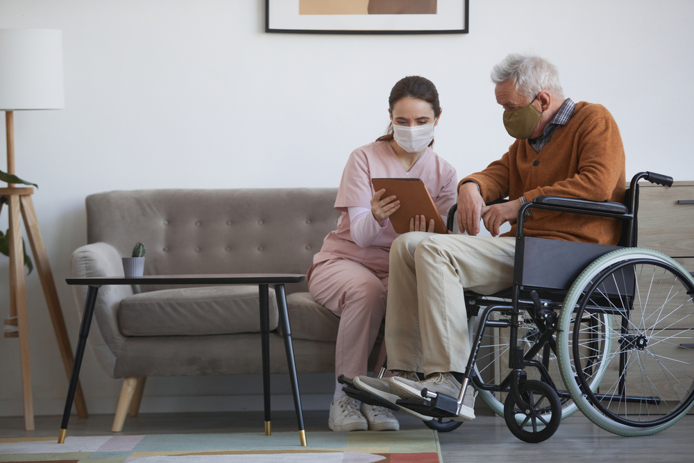 Doctor analysis of wheelchair bound patient