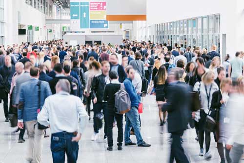 Image of airport departure lobby showing busy population