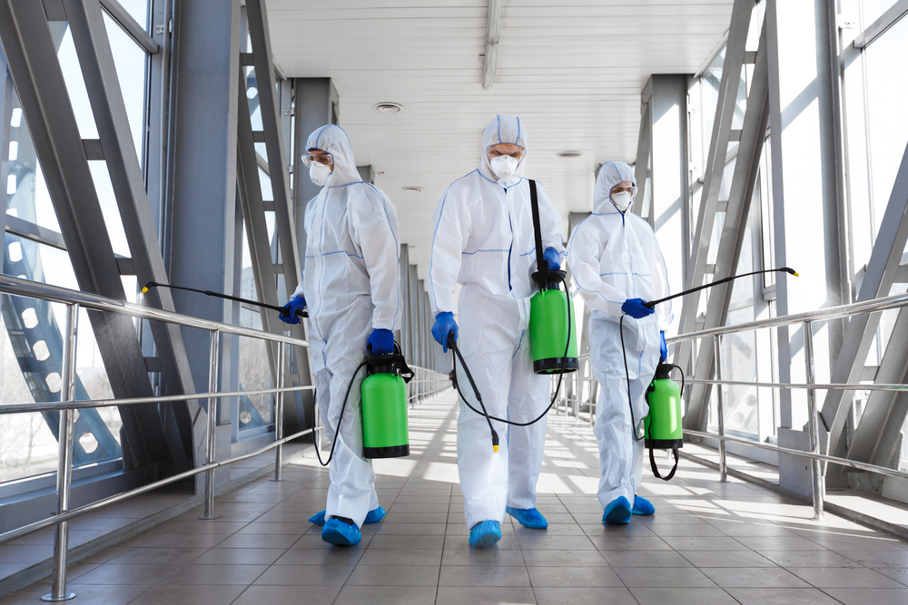 Vaccine disinfecting crew in hallway